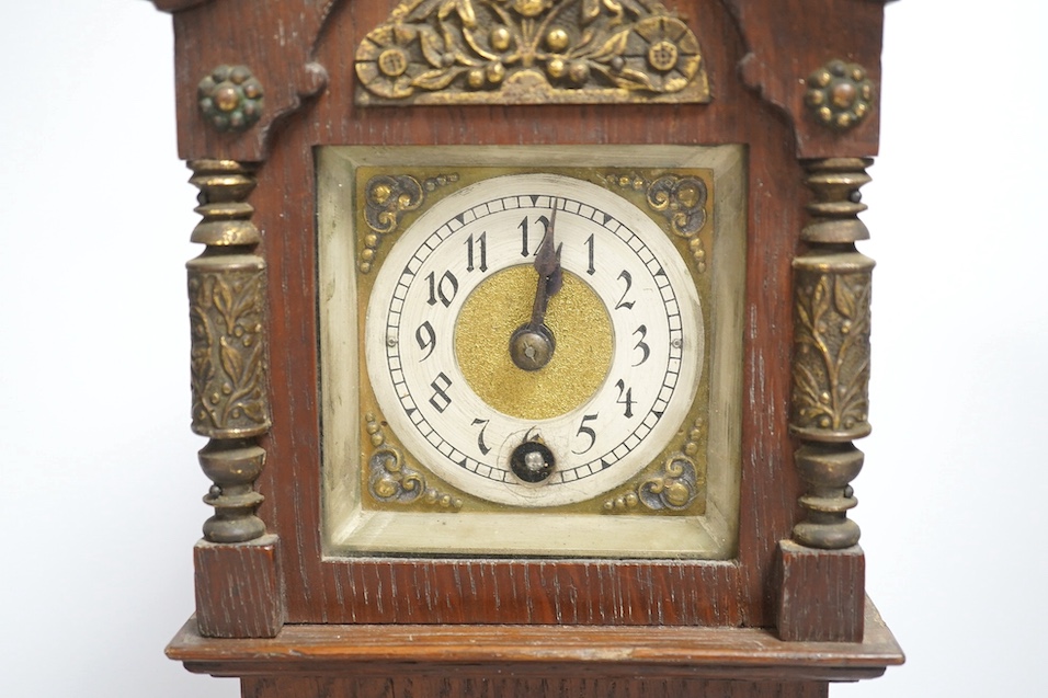 A miniature longcase clock and a miniature yew cylinder musical box, largest 42cm high. Condition - box poor, clock good